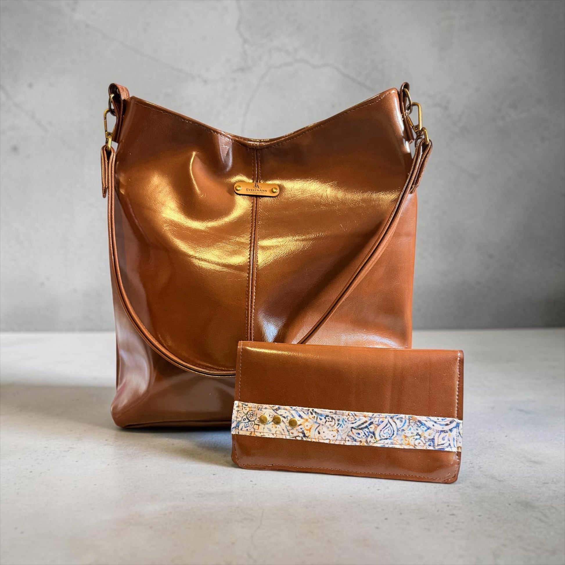 NspiVibe cognac brown hobo bag and matching wallet set with a polished finish and decorative patterned band