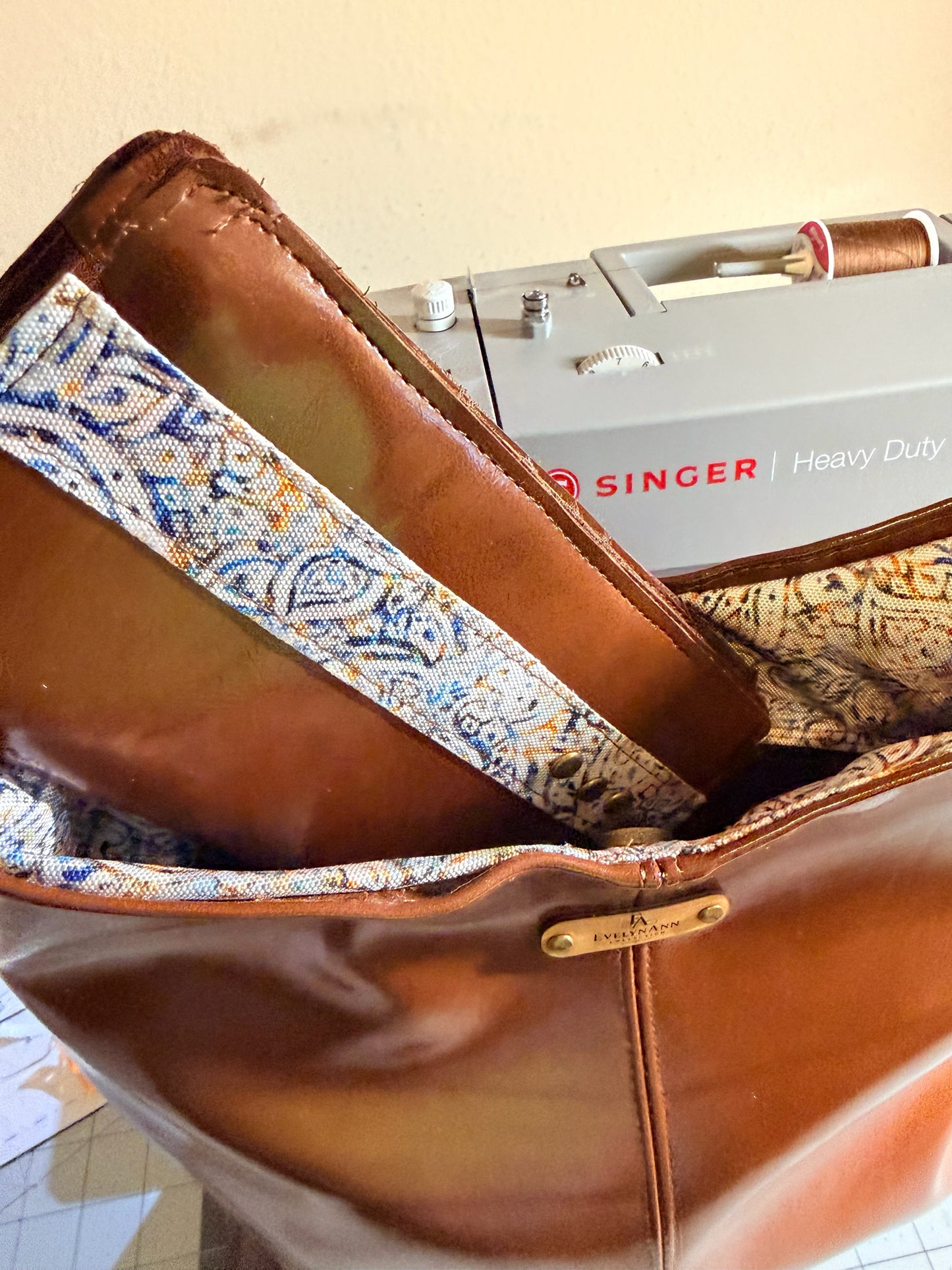 NspiVibe cognac brown hobo bag and matching wallet set with patterned interior lining and gold hardware